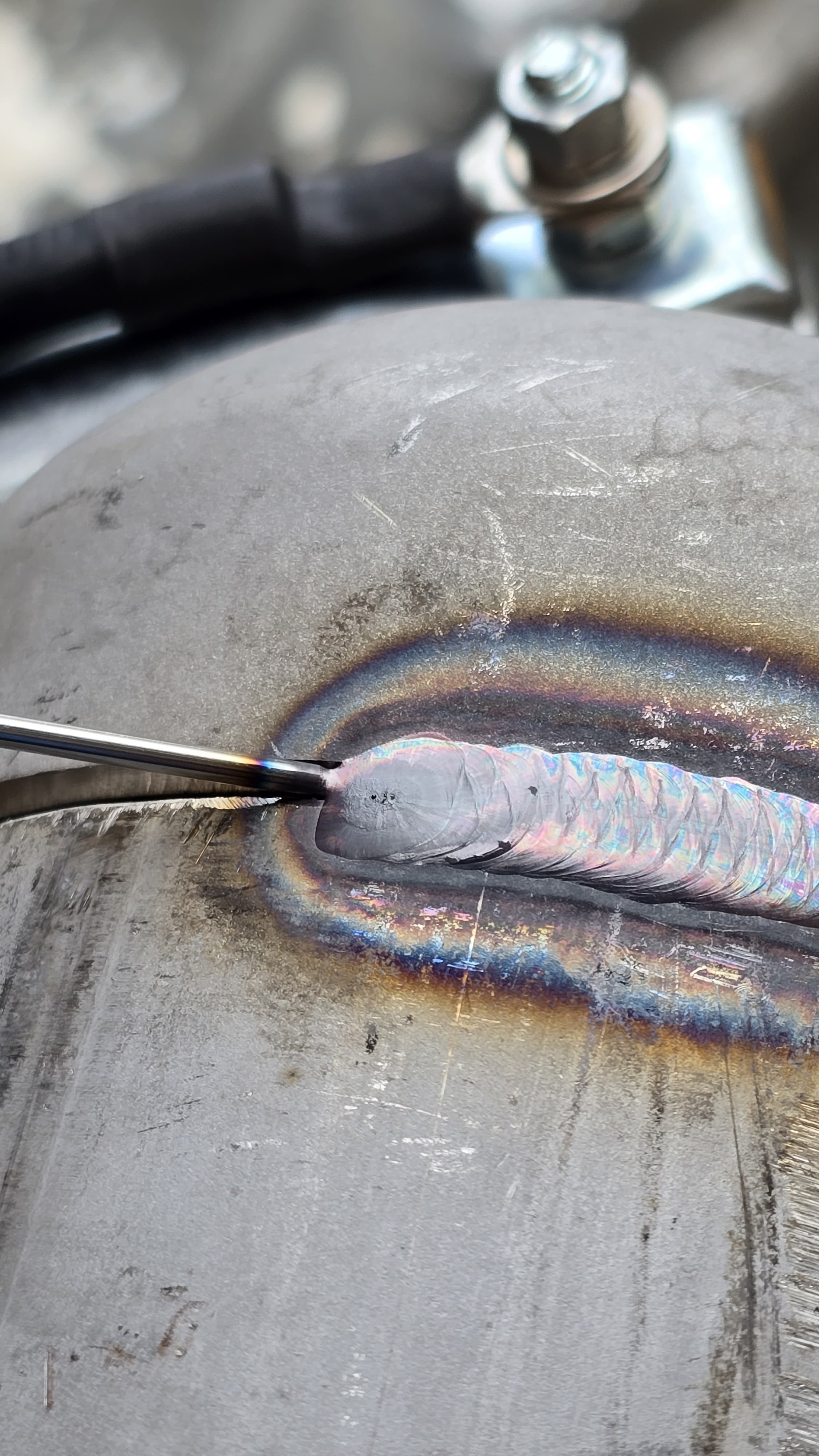 Portrait TIG welding close-up image.