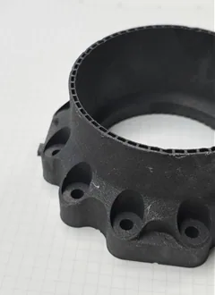 Sectioned circular Inconel 718 specimen showing the engine wall and internal cooling channels.